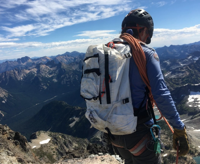 Why is a backpack an ideal bag for mountaineering? 
